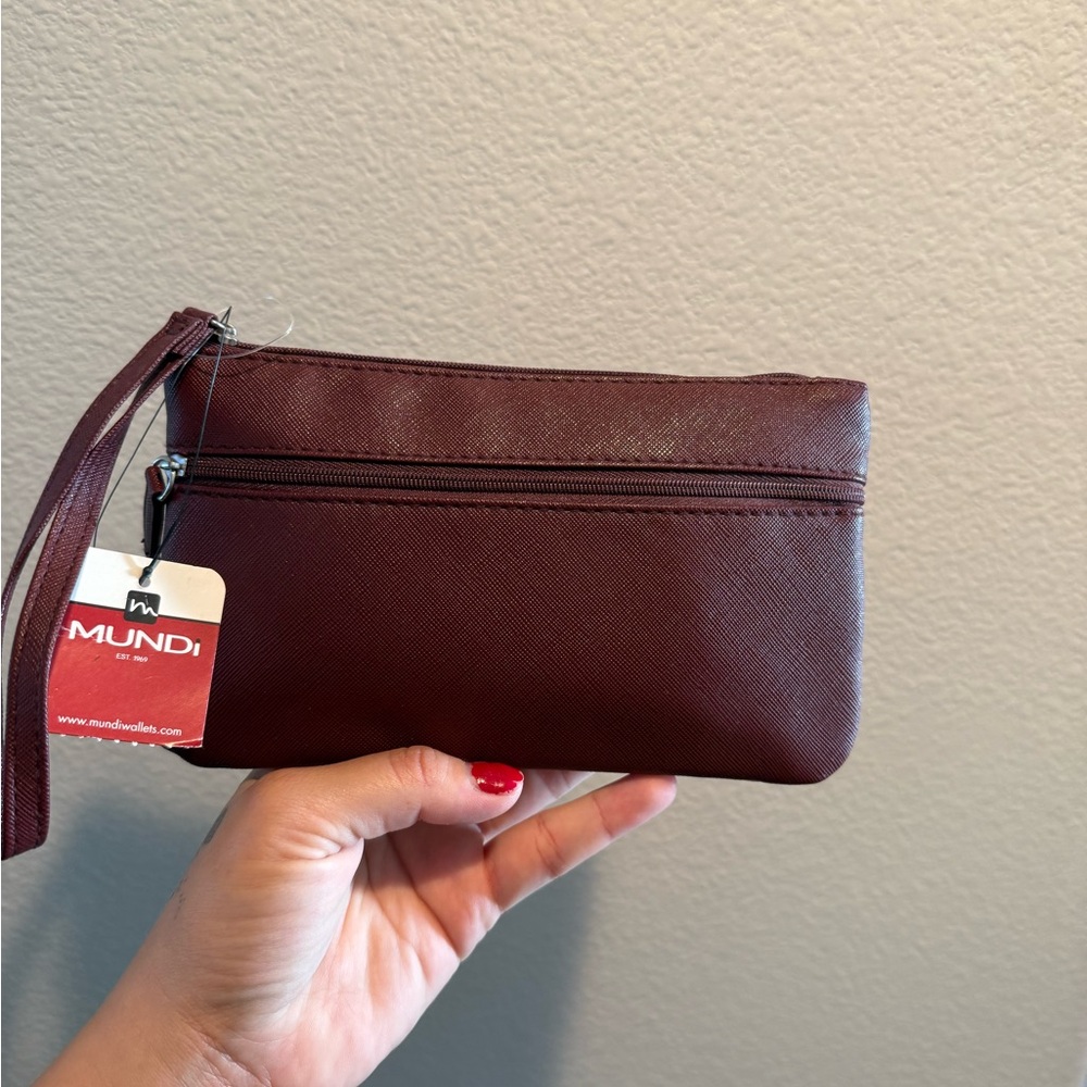 Maroon Clutch with portable charger and wallet inside
